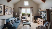  Inside you'll find a warm welcome in its living area, decorated in soothing tones of ocean blue