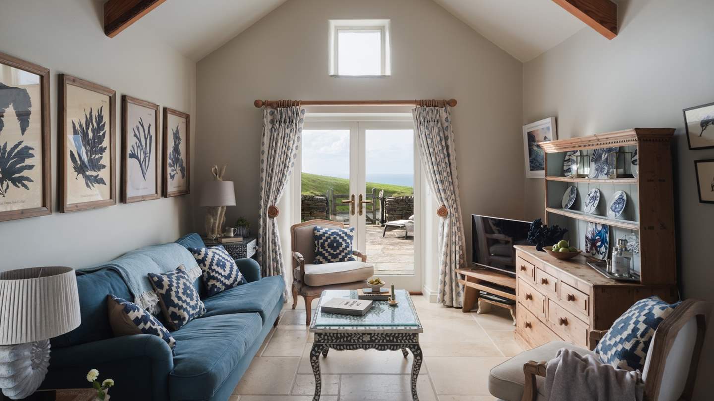  Inside you'll find a warm welcome in its living area, decorated in soothing tones of ocean blue