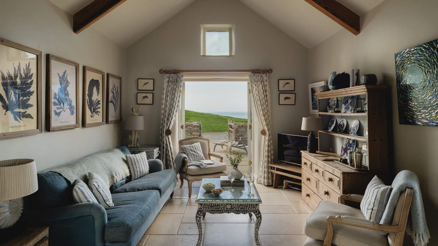 This beautiful homestay inspires relaxed moments throughout the day with an open-plan living area with high ceilings and impressive wooden A-frame beams
