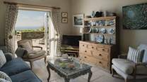 With a wonderful elevated position, the views over the farmland across to the sea are simply a dream
