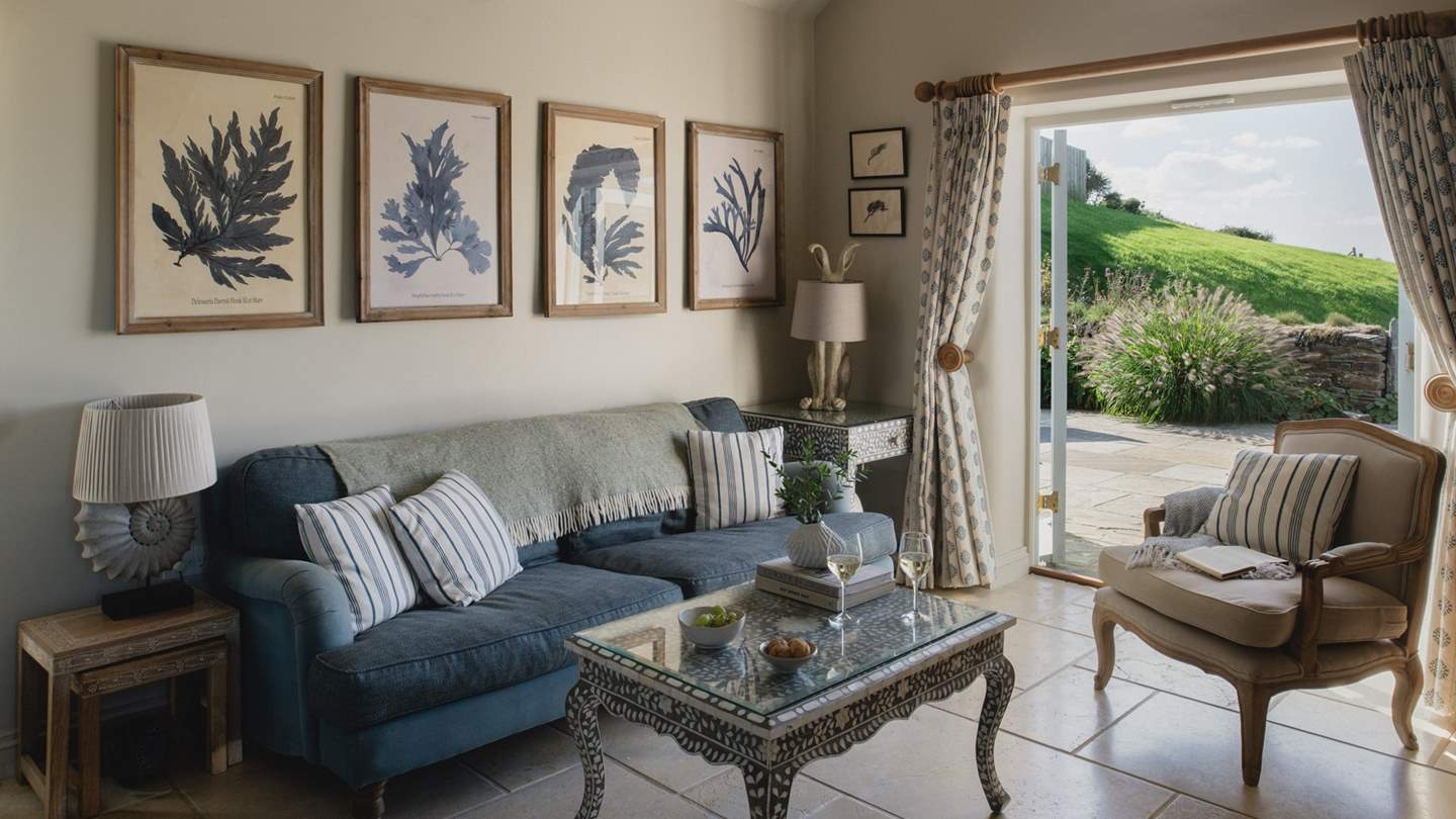 Inside you'll find a warm welcome in its living area, decorated in soothing tones of ocean blue