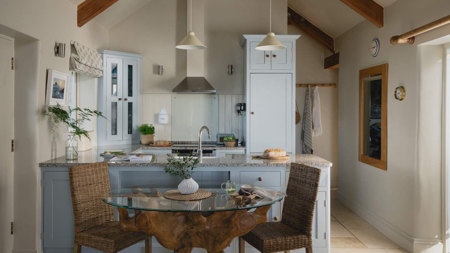 Adjoining the downstairs living area is a pretty kitchen containing everything you need to create a culinary delight