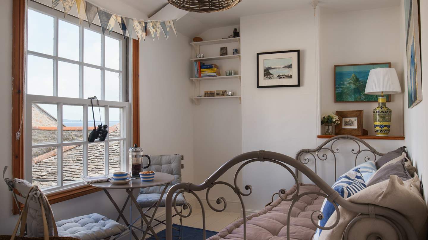 At the back of the cottage you'll find a super cute reading snug with a French day bed made for snoozing... 