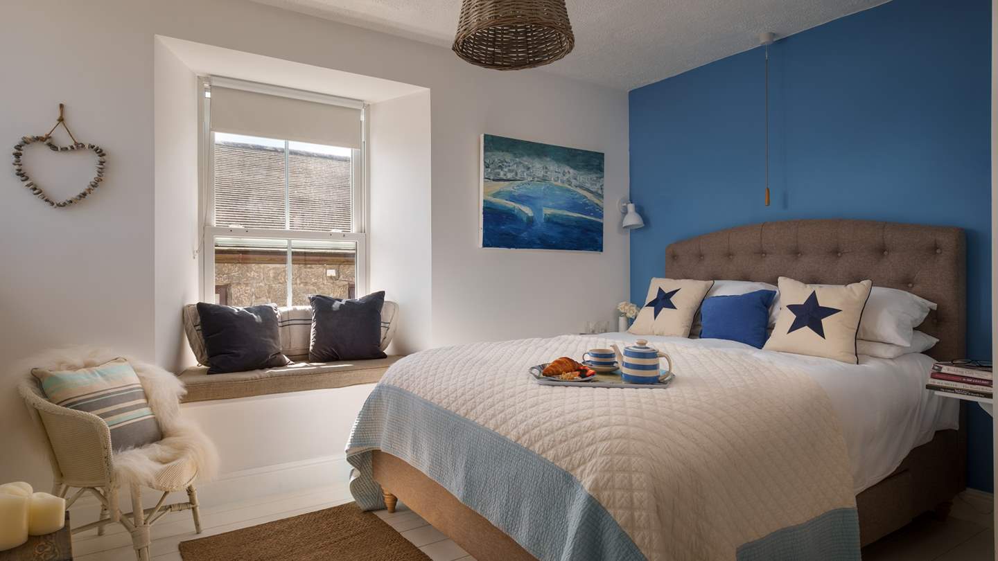 We just adore the charming window seat in the master bedroom...