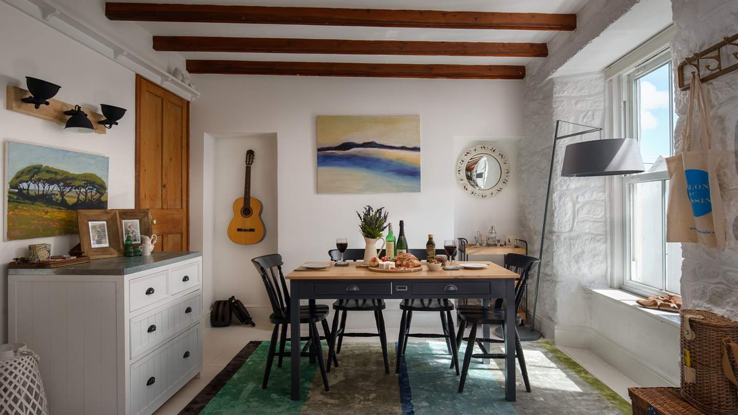 The dining is area complete with country-kitchen style dining table and cocktail trolley to tempt the mixologist in you