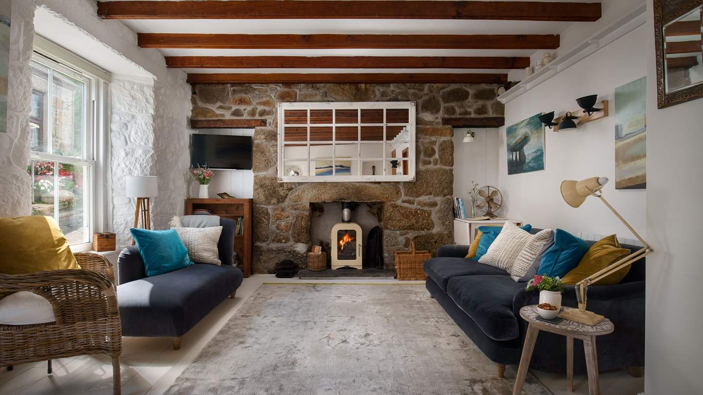 Step inside to uncover a stunning living room dressed in rich colours and complete with luxurious sofas to stretch out in style...