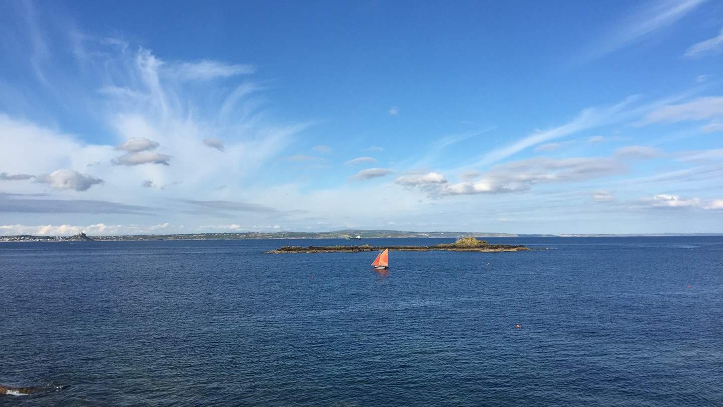 Spend the day watching the boats sail by from the pretty waterside garden