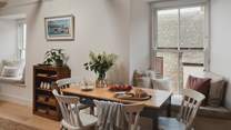 Gwella’s two gorgeous living spaces reside upstairs, with windows overlooking the glistening ocean, Mousehole’s characterful rooftops, and St Michael’s Mount beyond