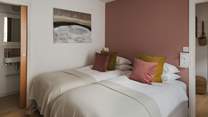 The second bedroom can be configured as either two single beds or one luxurious super king bed