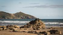 Explore the golden sandy shores of Whitsand Bay