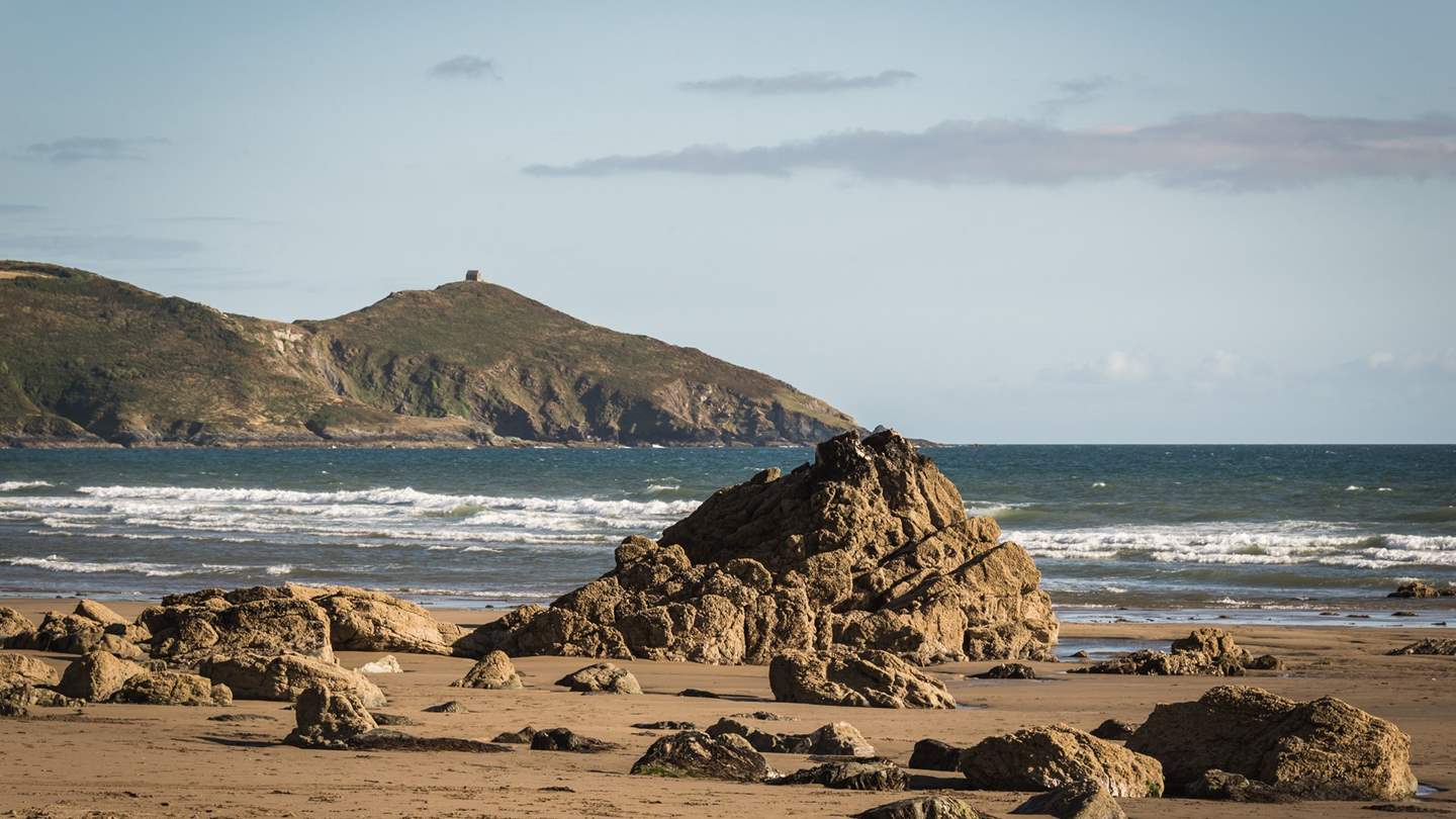 Explore the golden sandy shores of Whitsand Bay