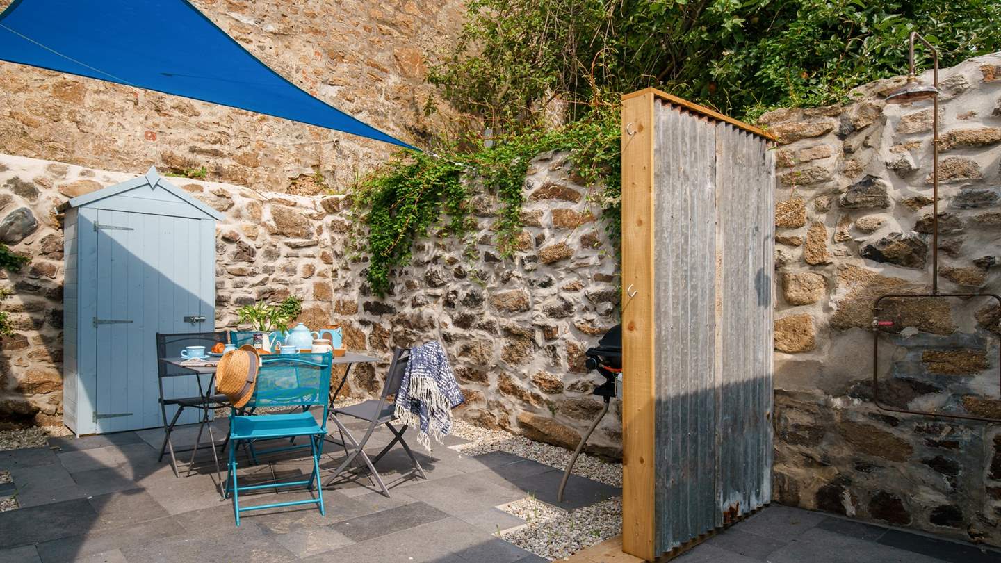The tucked-away, secluded courtyard garden is a real sun trap - ideal for alfresco meals!