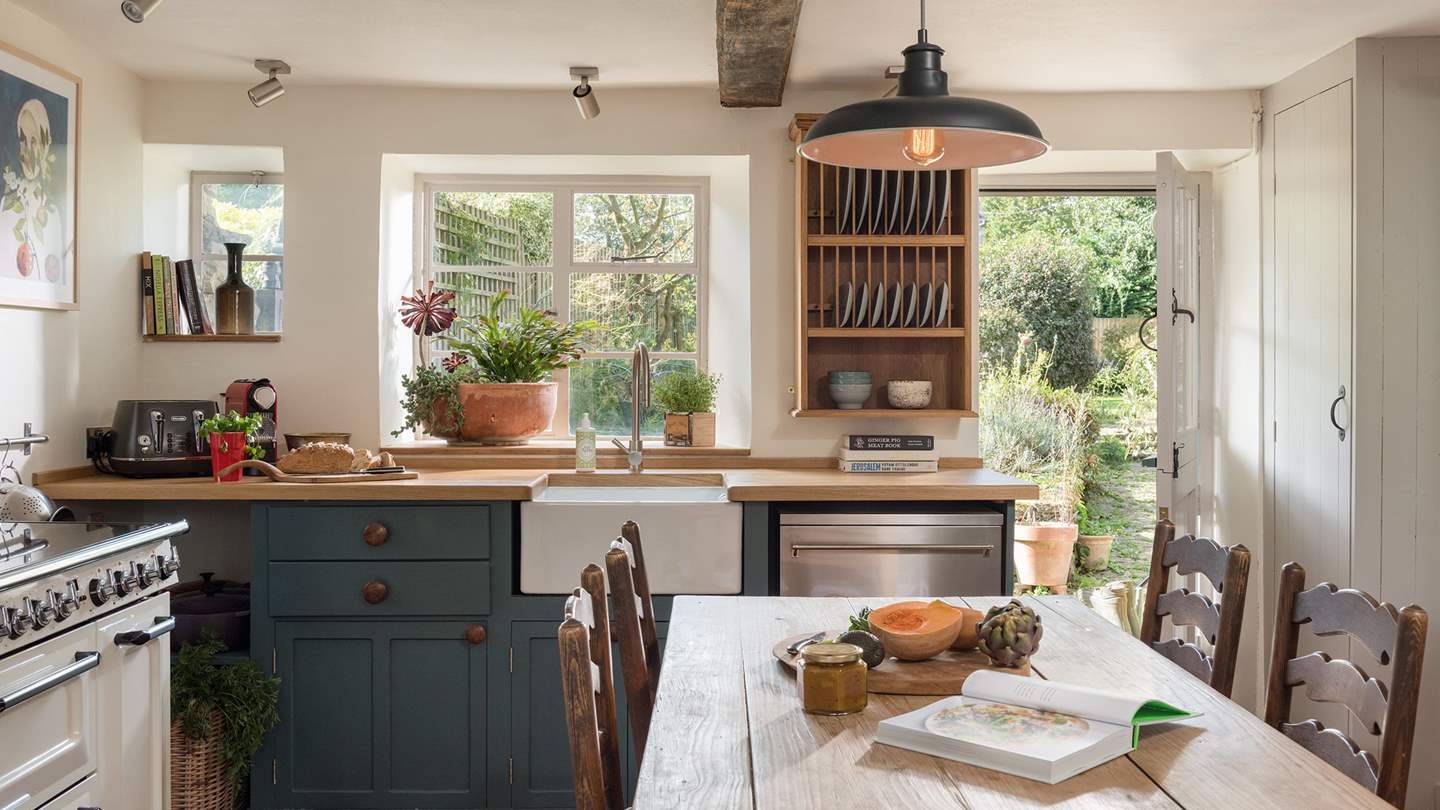 The relaxed, country-style kitchen oozes charm while affording modern luxuries. 