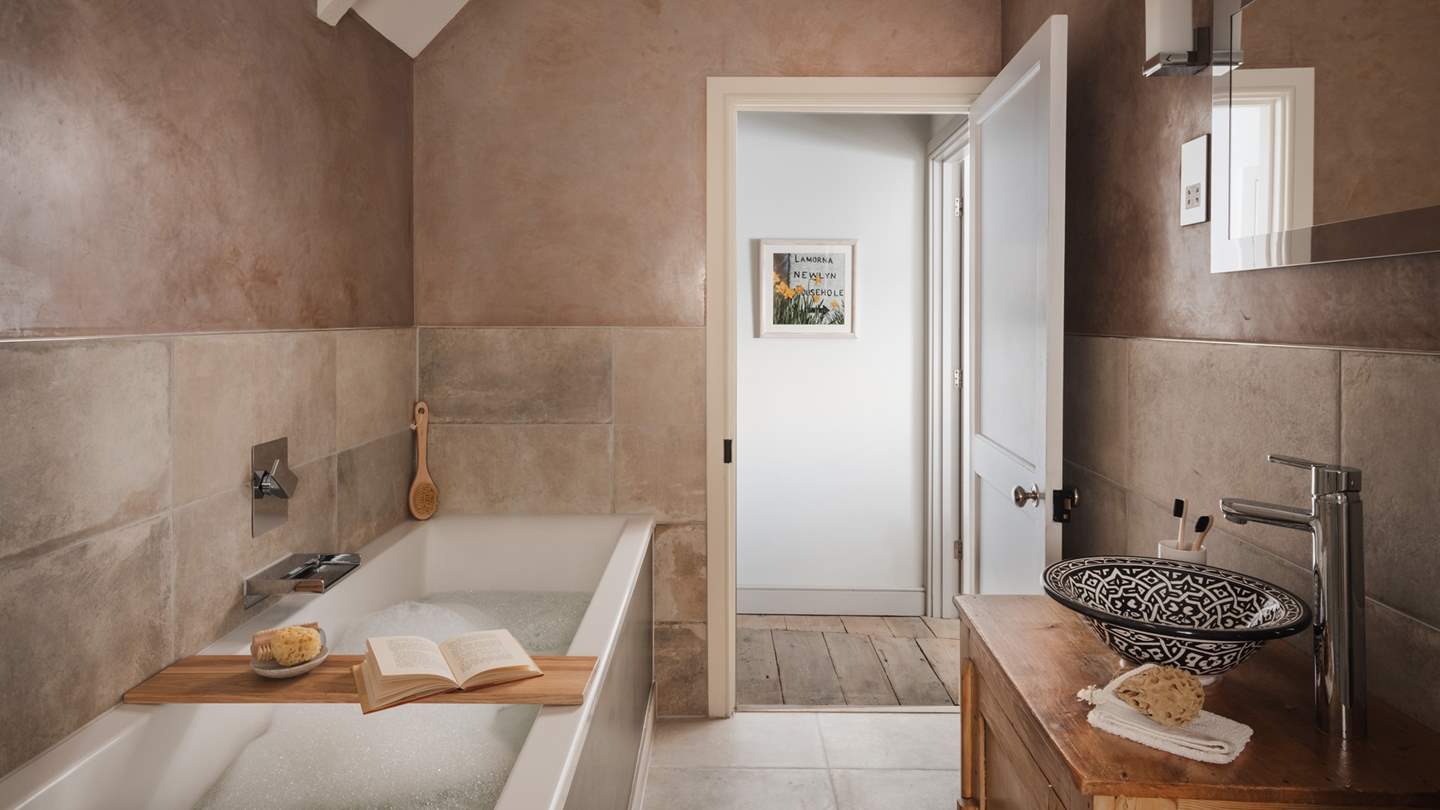 Savour bubble-topped soaks in the deep bathtub 