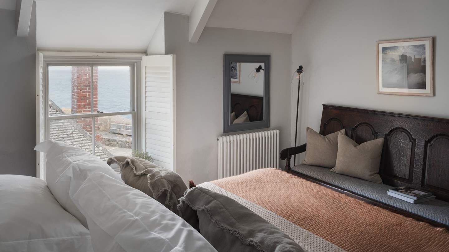 Beckoning for nights of restful repose, the light-filled master bedroom awaits...