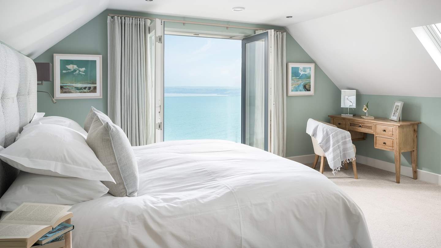 The en suite master bedroom lies on the first floor to the front of the house, and enjoys mesmeric sea views that can be enjoyed from the embrace of the super king size bed