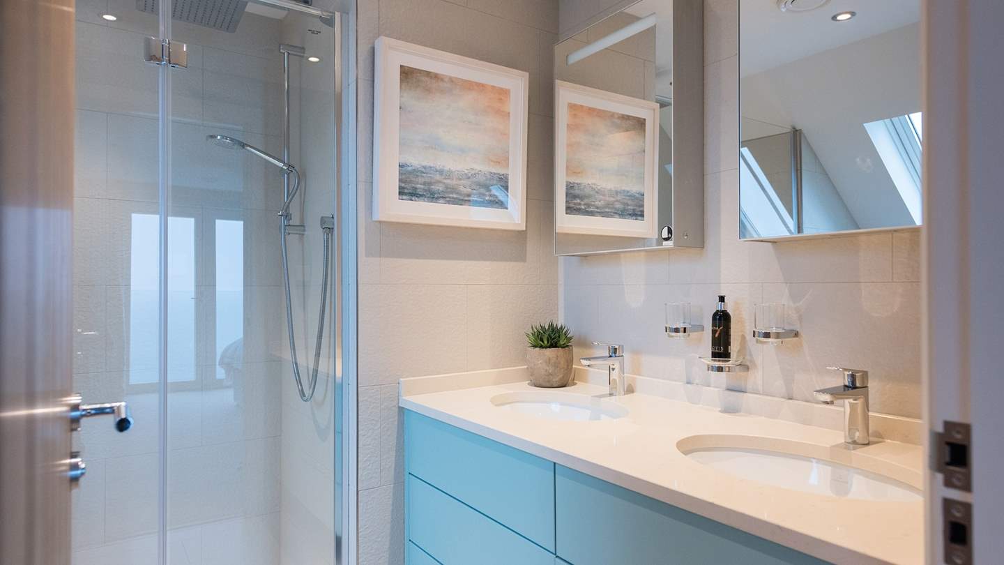 The en-suite has a wonderful walk-in shower and twin vanity units 