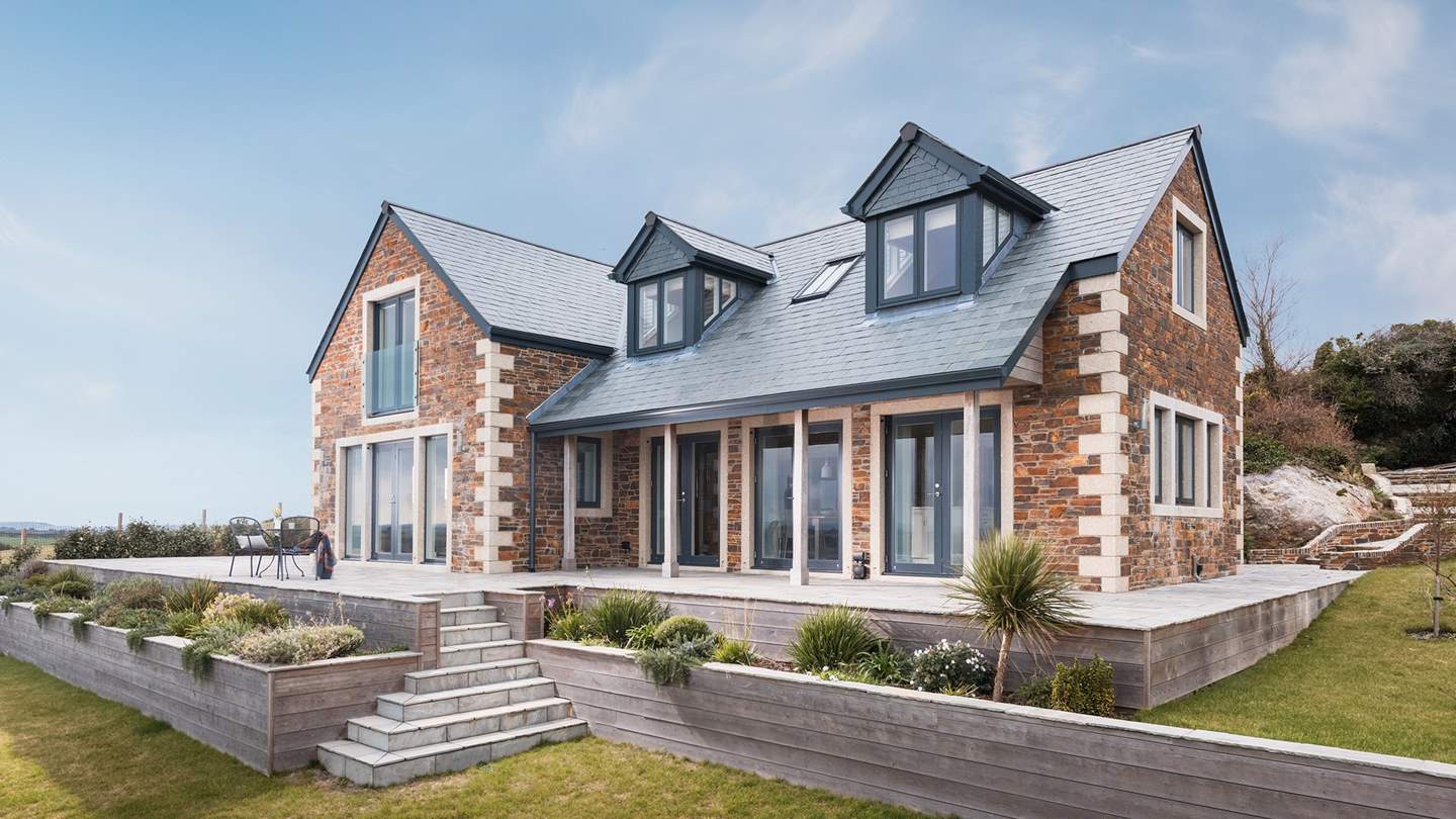 Open the glass doors and step onto the expansive stone terrace with just the most astounding 180-degree sea views across to Carne Beach and along the Roseland coastline