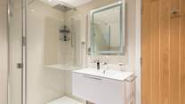 The shower room can be found on the ground floor, with underfloor heating and heated towel rail