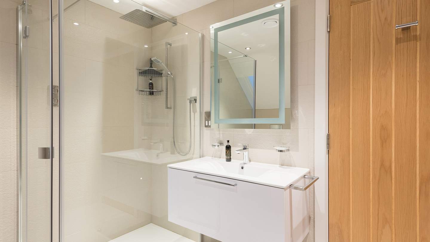 The shower room can be found on the ground floor, with underfloor heating and heated towel rail
