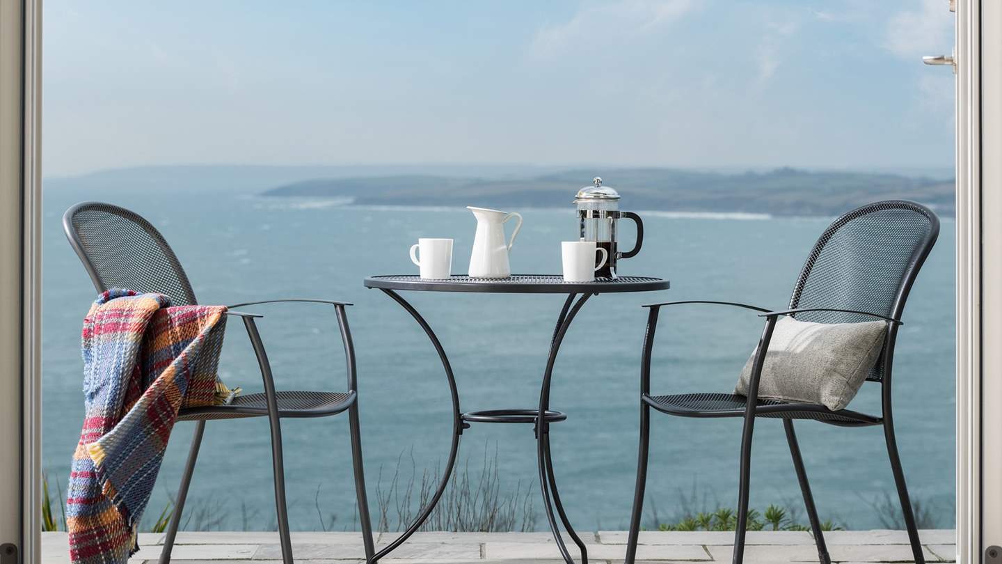 Steps lead down to a lawned garden which wraps around the whole property