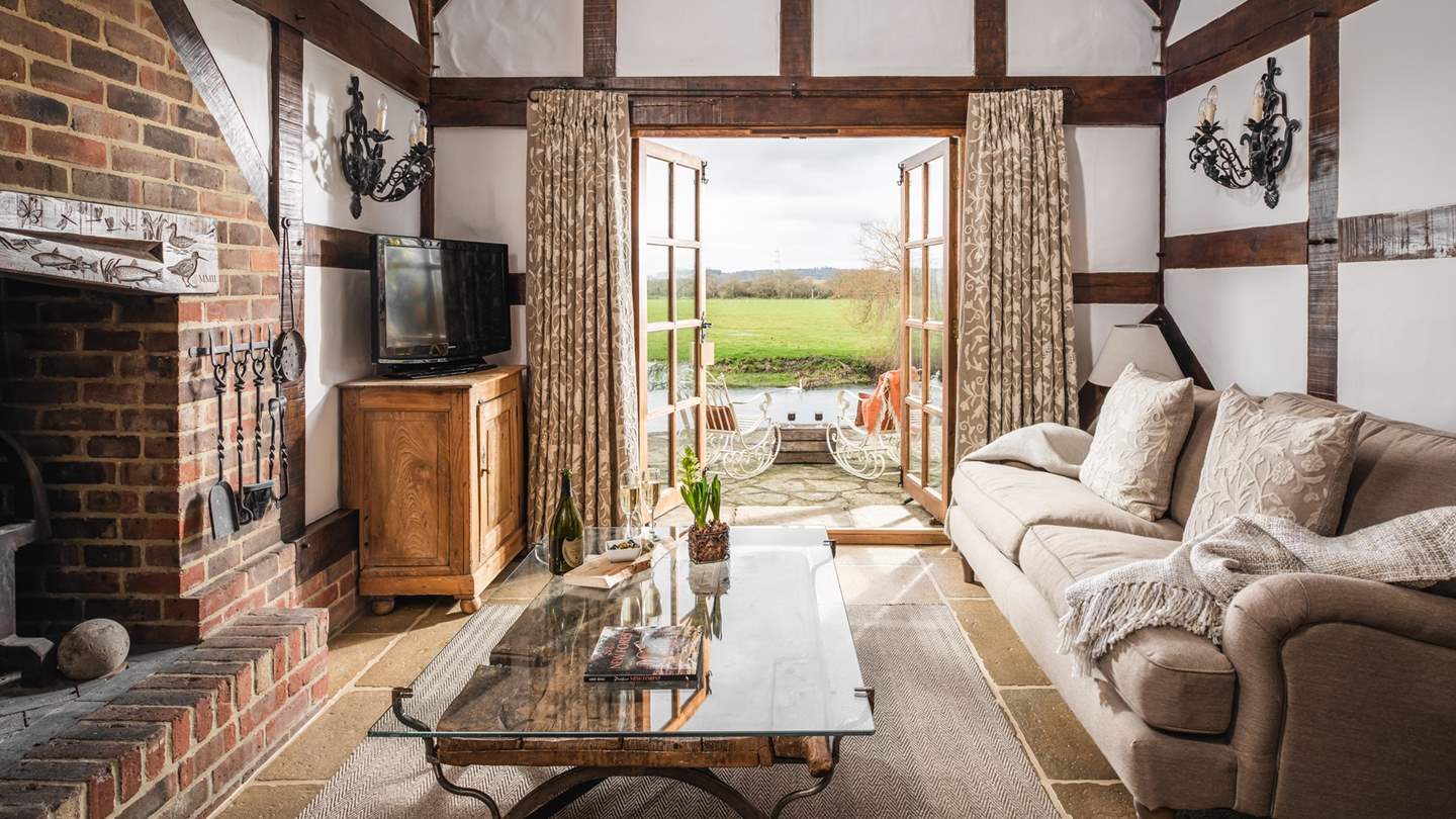 During warmer months, let the outside in by opening the pretty French windows - bliss!