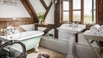 The fabulous family bathroom is just what you need for long soaks in the bathtub made for two.