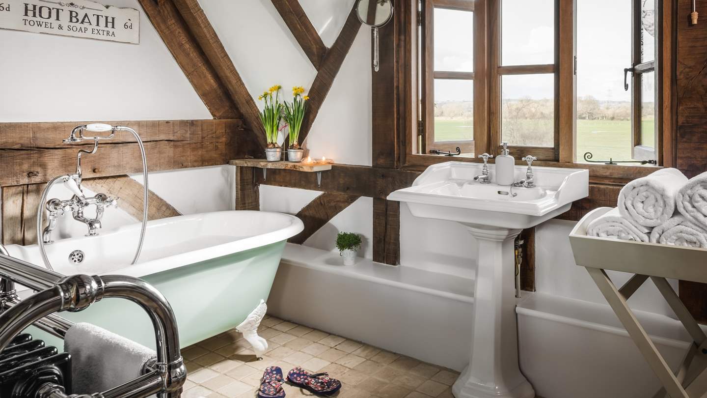The fabulous family bathroom is just what you need for long soaks in the bathtub made for two.