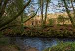 Nestled in tranquil woodland within the wild beauty of nature, you'll find this luxury lodge and even a babbling brook...