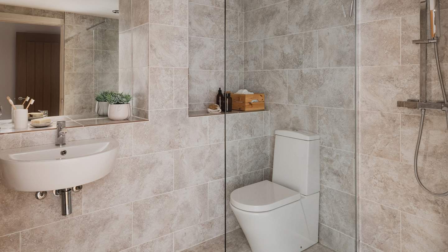 This calming en suite also promises underfloor heating and a walk-in shower...