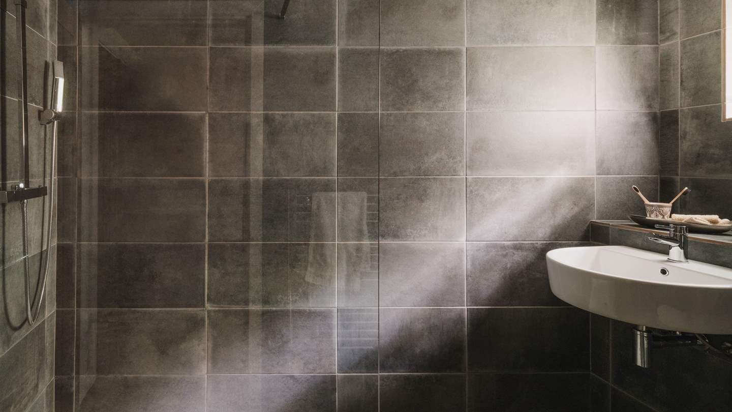 We adore the slate-grey tiles in this sumptuous space