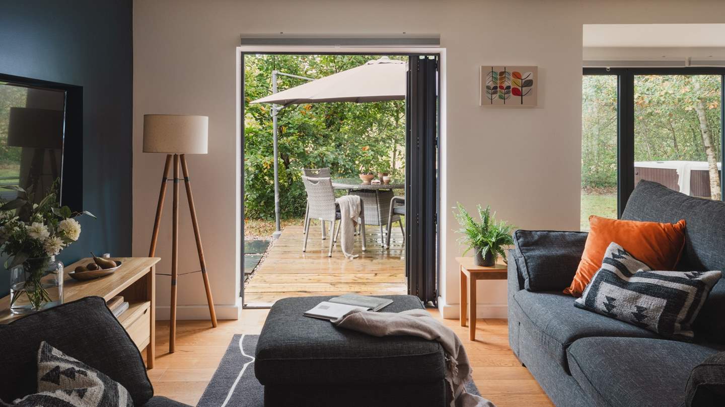 Let the outside in through the modern bi-fold doors which lead to the wooden deck...