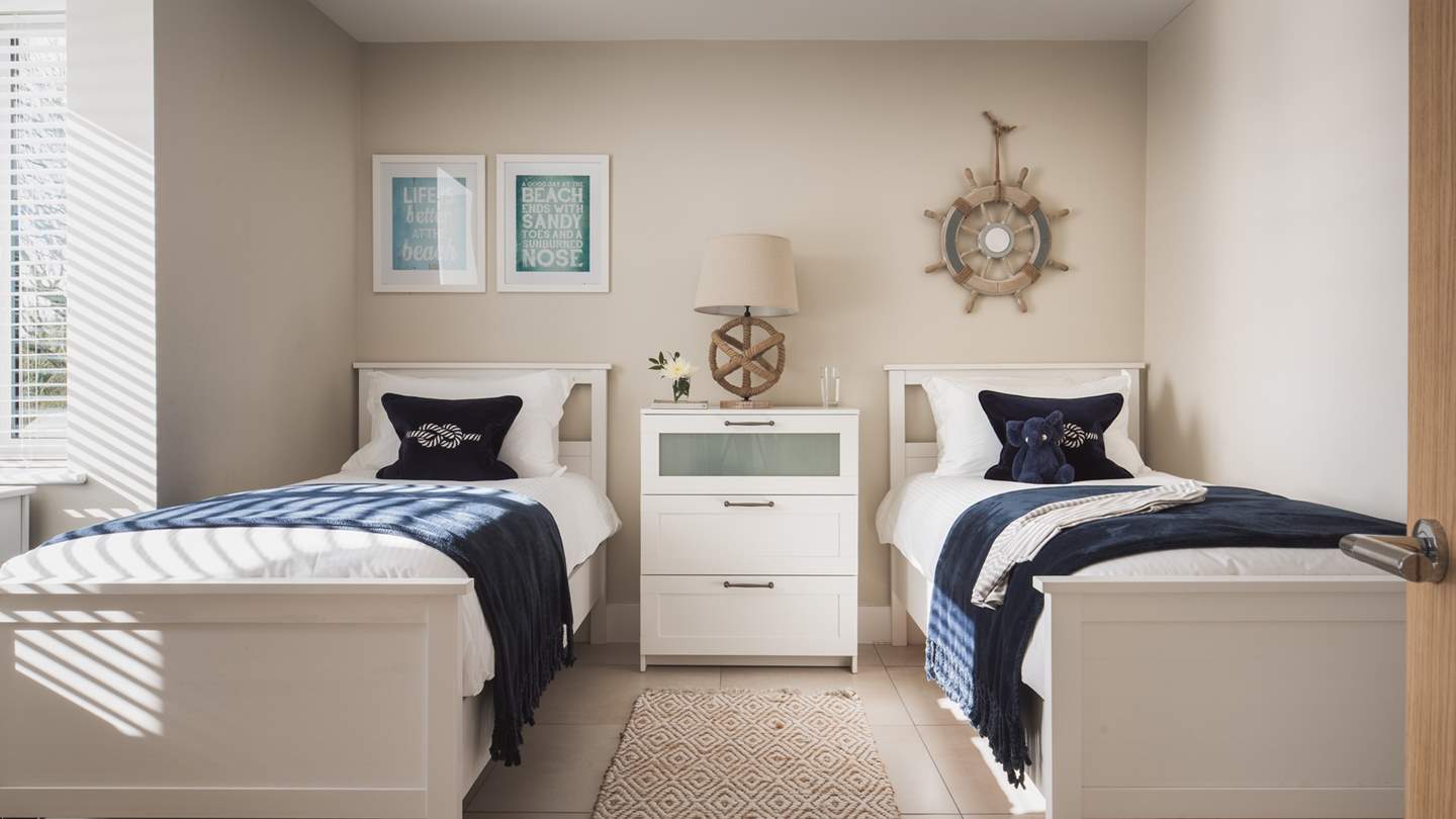 Downstairs, you'll find two twin bedrooms both with a large double wardrobe, dressing table and Smart TV