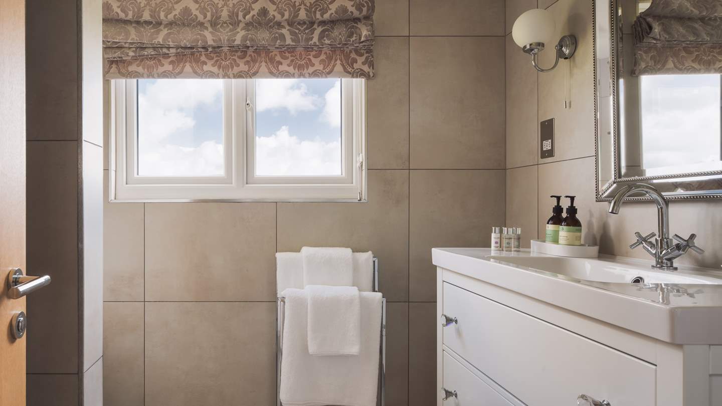 The en suite has a rainfall shower for relaxing after a day exploring