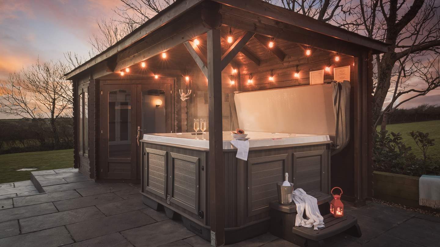 Take a dip in the hot tub as the sun sets over the trees...