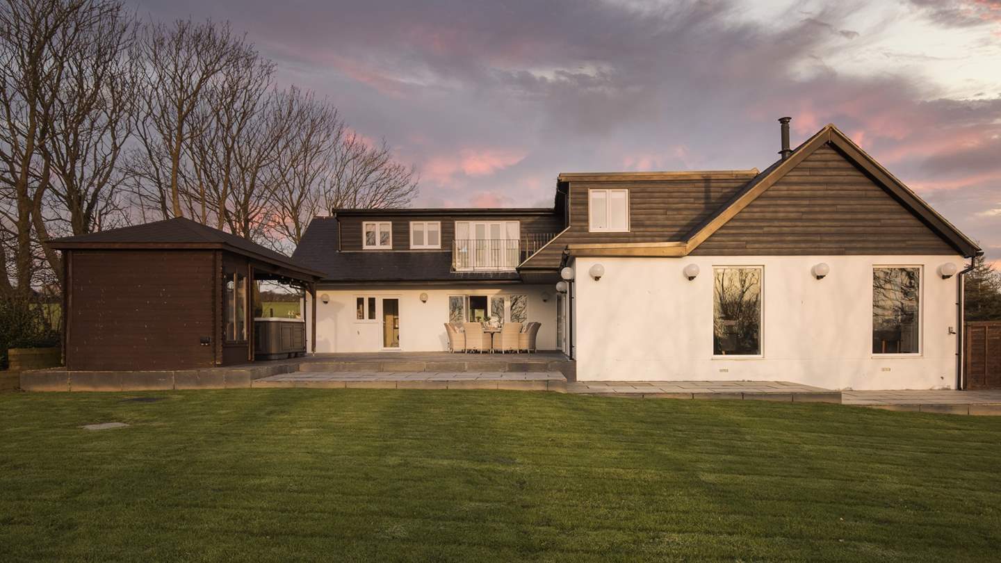 The perfectly enclosed garden has lots of lawn space - perfect for children to play in safety whilst you relax with a glass or two of something chilled