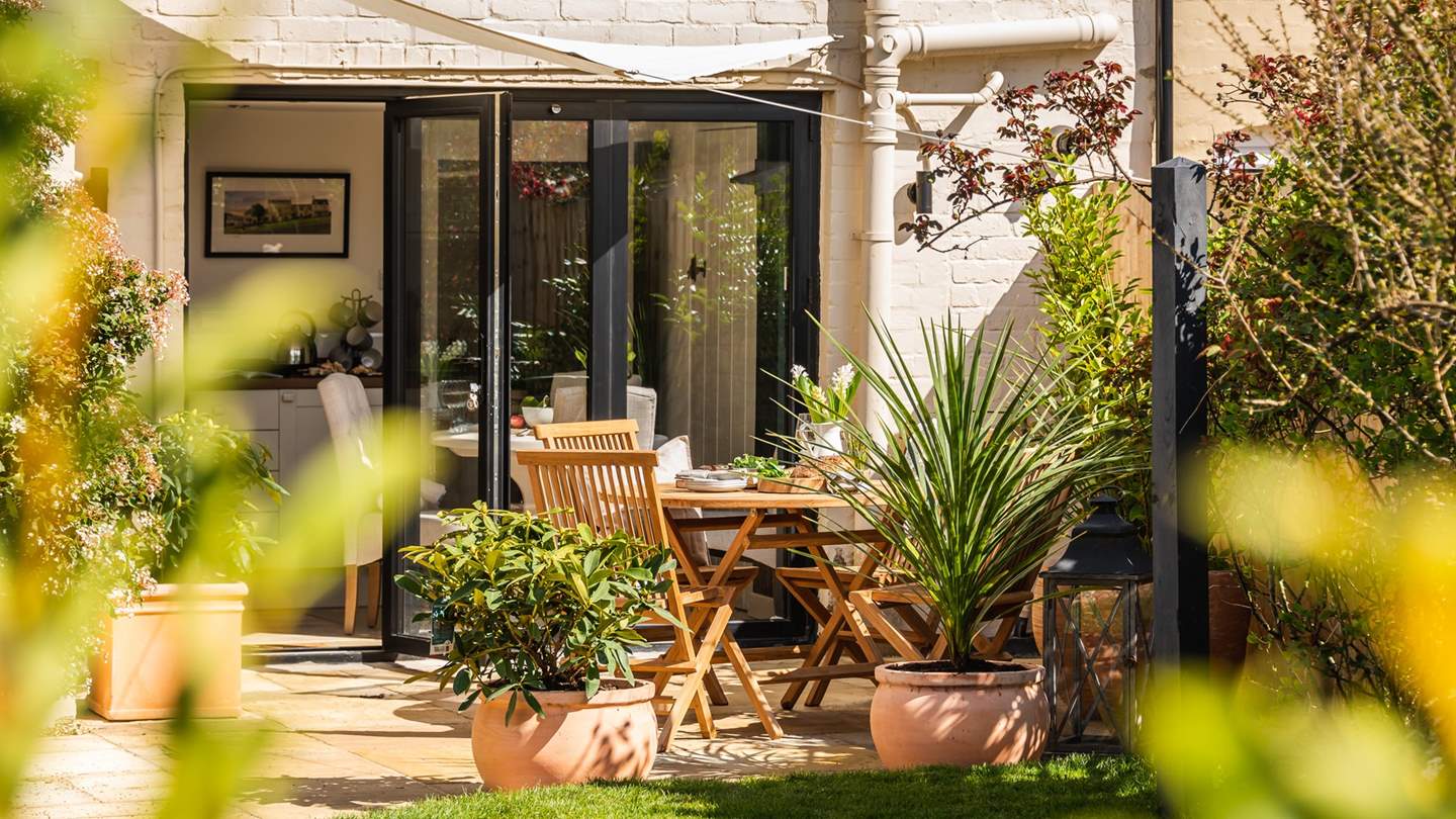 Step through the glass doors in the kitchen and you'll discover a heavenly garden