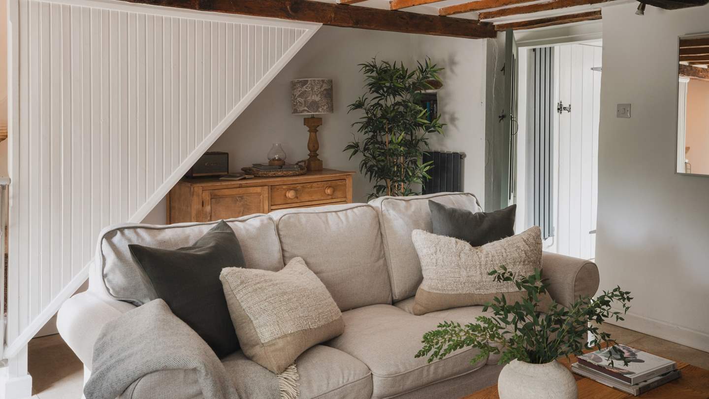 The cosy sofa settled in front of the inglenook stone fireplace is utterly magical 