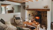 Spend cosy evenings beneath rustic beams with a glass of something special in hand 
