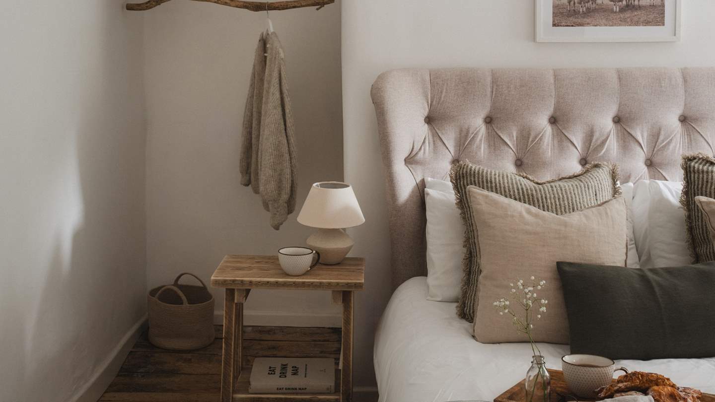 The stylish master bedroom exudes elegance and sophistication