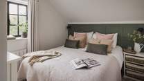 The second bedroom is a petite and cosy version of the former but just as heavenly and charming