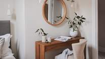 A dressing table promises a serene setting for pampering moments