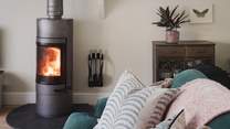 A wood burning stove creates dreamy fireside moments in the cosy season