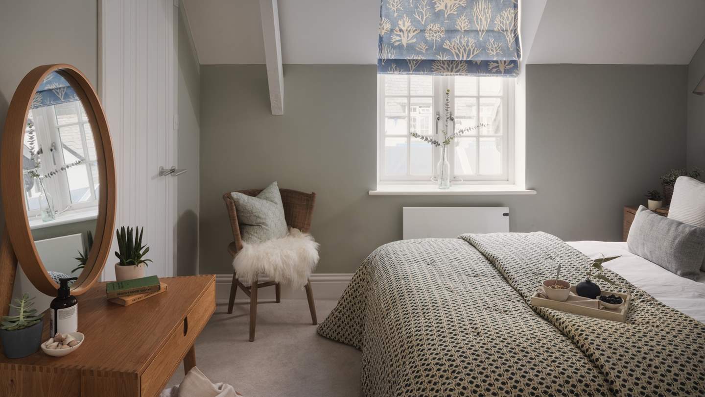 At the centre, a sumptuous king-size bed topped with a cloud-soft duvet, throws and cushions promises utmost comfort