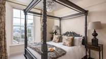 The second en suite bedroom lies to the back is an absolute corker with a majestic king-sized four-poster bed