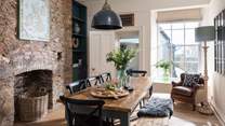 In between the kitchen and sitting room lies the dining room with a lovely table that easily seats eight