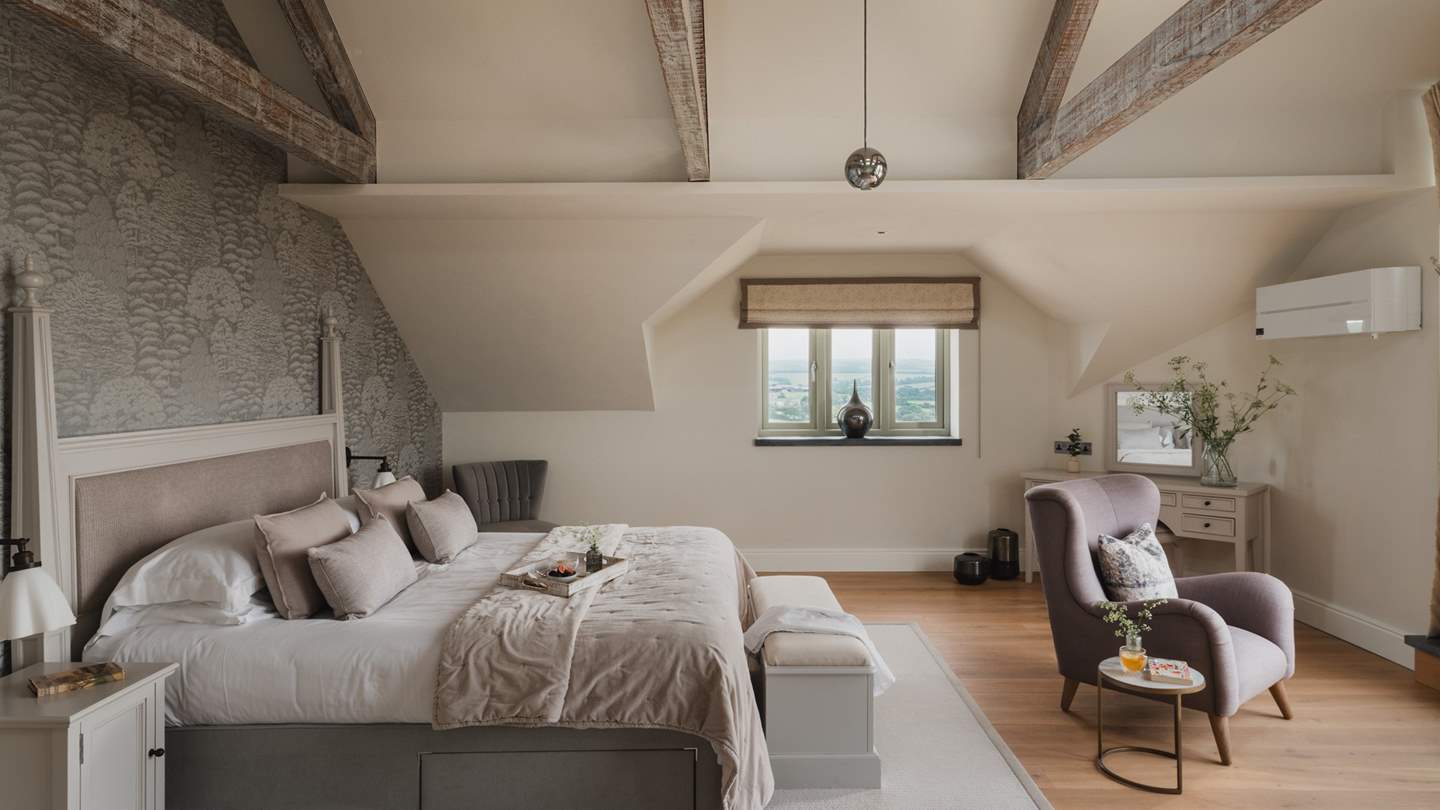 A charming dressing table lies in the corner of this space, with plenty of storage for your treasured belongings 