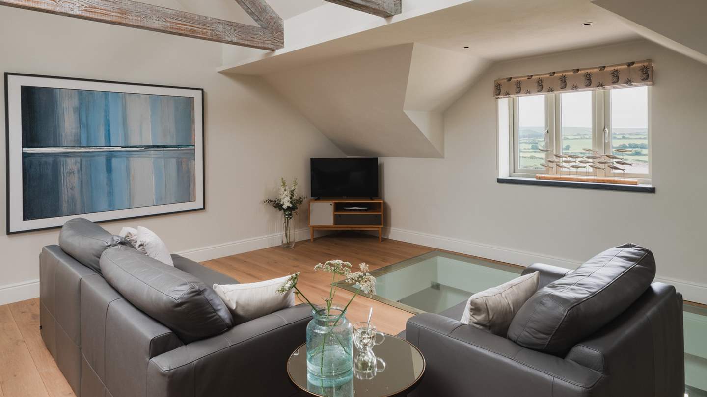 The cosy upper sitting room is perfect for adults seeking a little seclusion