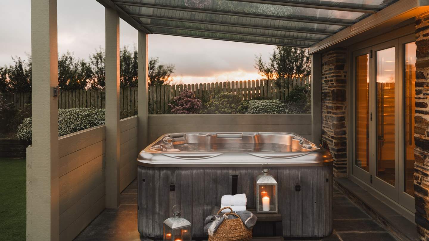 For soaks under starry skies, a outdoor hot tub resides in the corner, a perfect place to watch the sunset