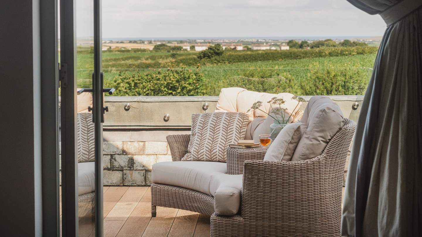 Step out to your own private balcony with far-reaching countryside views and the sea on a clear day